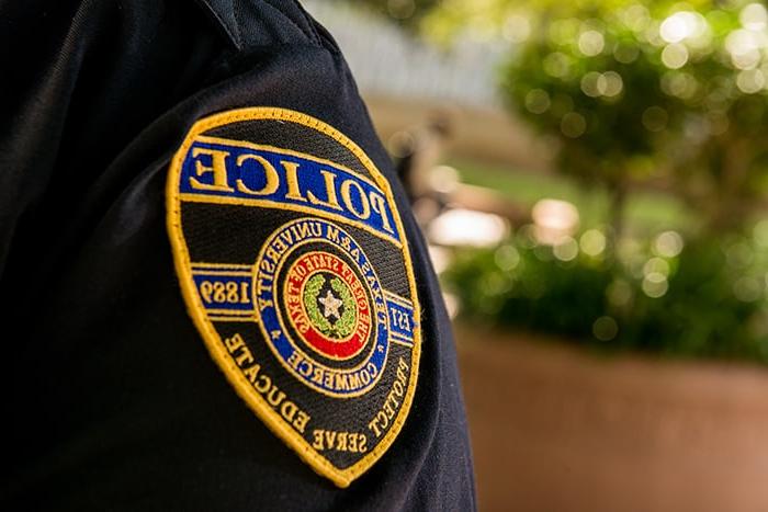 Close up of a police badge on uniform.